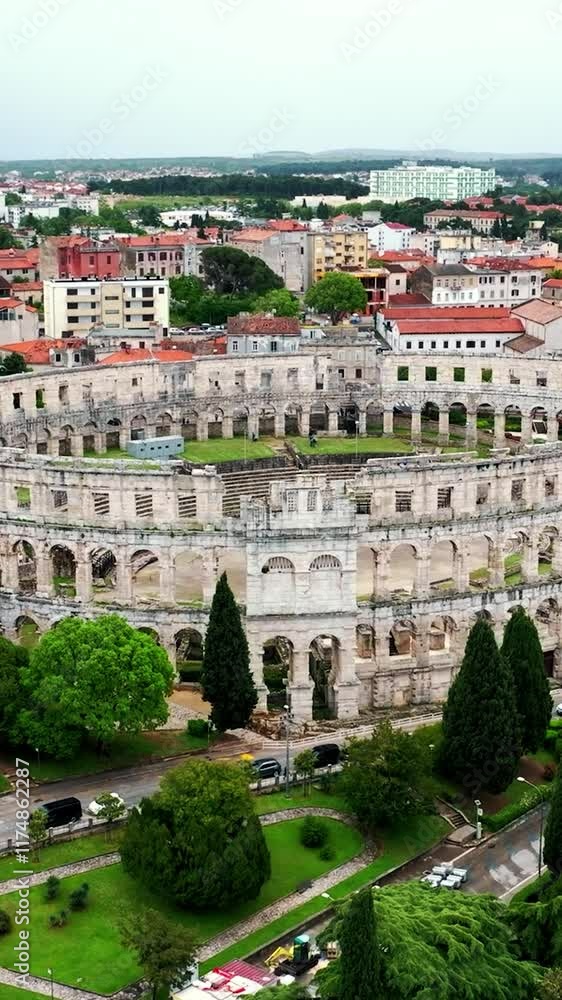 Flying above historic city of Pula , historic Roman amphitheatre of Pula aerial view, tourism in Croatia Flying above historic city of Pula , historic Roman amphitheatre of Pula aerial view, tourism in Croatia