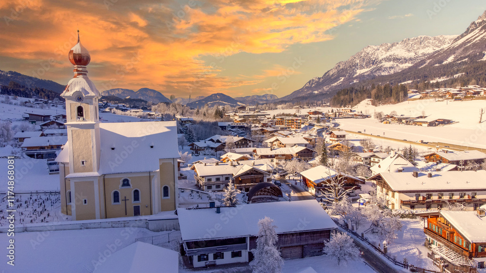 View of the the village church in Going at Wilder Kaiser in Austria Tyrol European Alps at sunset
