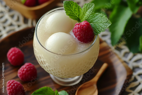 Refreshing lychee drink with raspberry, lime, mint leaves and ice. Non-alcoholic sparkling cocktail fizzy drink perfect for summer hydration.ultraraw photo