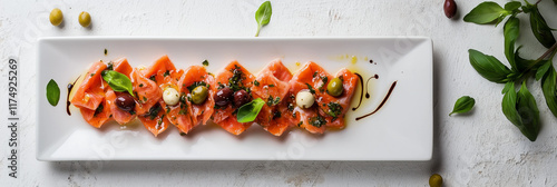 Colorful lyutenitsa platter arranged with olives and herbs, culinary art photo