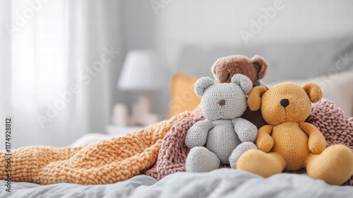 Cozy scene of bed with plush toys, featuring gray bear and yellow bear, surrounded by colorful blankets. This inviting atmosphere evokes warmth and comfort photo