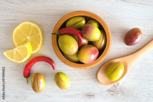 green olives on a wooden background