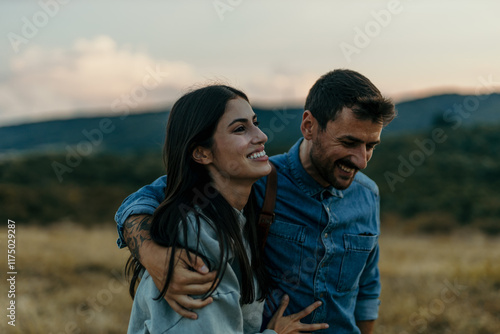Loving couple enjoying a road trip with a car, taking a break and decided to walk and explore nature.