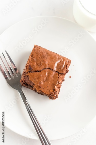 Фотография Chocolate brownie on a plate with fork.