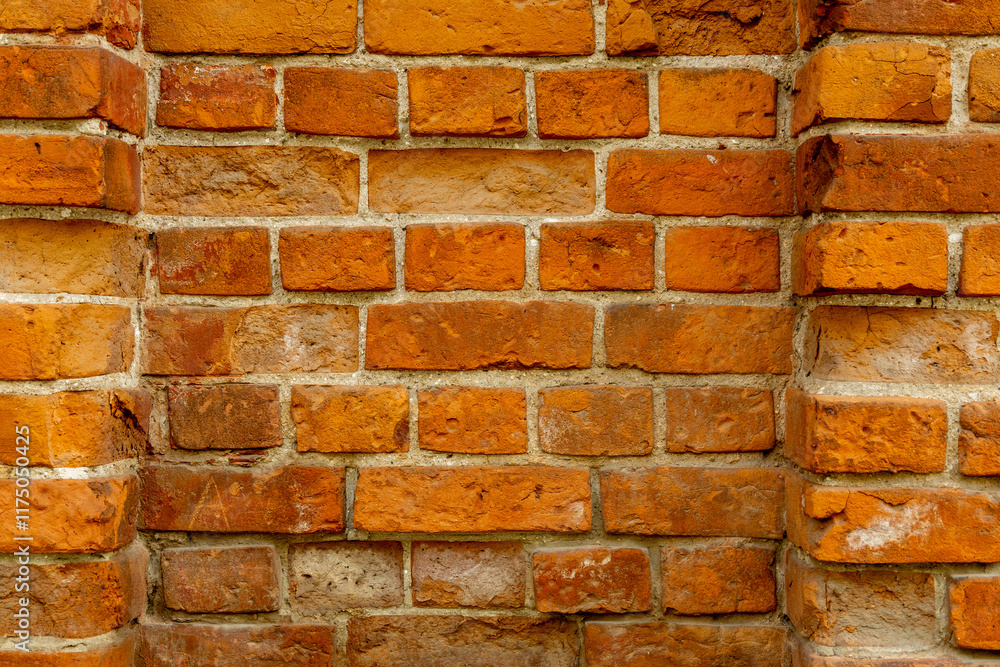 Traditional red brick wall showcases distinct textures and colors, highlighting craftsmanship and durability in construction. Traditional red brick wall showcases distinct textures and colors, highlighting craftsmanship and durability in construction.