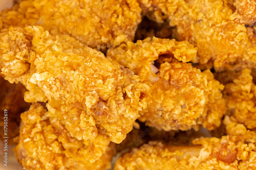 Crispy golden fried chicken wings arranged together, showcasing a mouthwatering texture and color, perfect for gatherings or a snack.