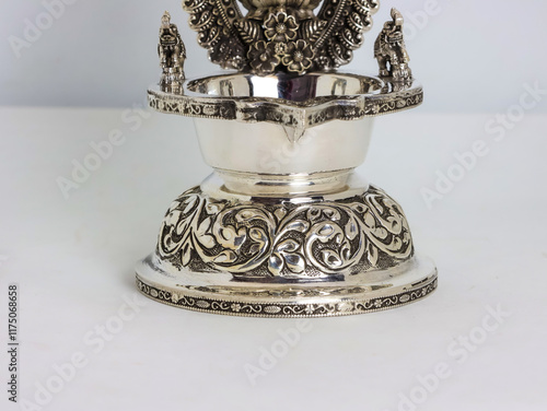 Sacred Silver Diyas with Indian God and Goddess Idols bring sacred blessings, prosperity, and spiritual charm to every home and celebration. Indian Pooja Diya. Pure 925 Silver Lamps used for praying photo