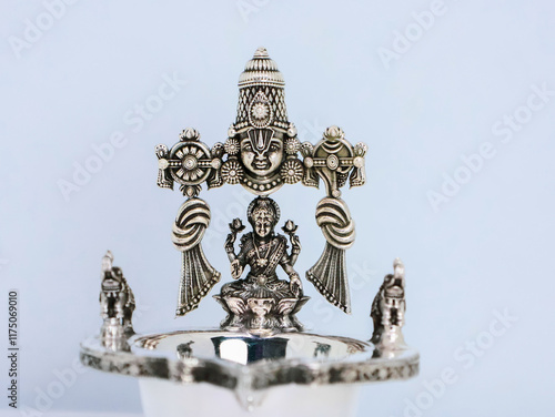 Sacred Silver Diyas with Indian God and Goddess Idols bring sacred blessings, prosperity, and spiritual charm to every home and celebration. Indian Pooja Diya. Pure 925 Silver Lamps used for praying photo