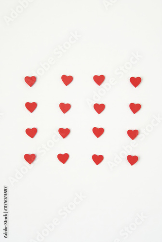 Grid of Small Red Hearts Evenly Spaced on a Plain White Background