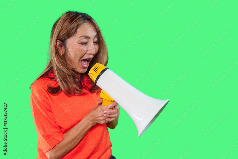 Woman passionately speaking into a megaphone in a bright green background Woman passionately speaking into a megaphone in a bright green background