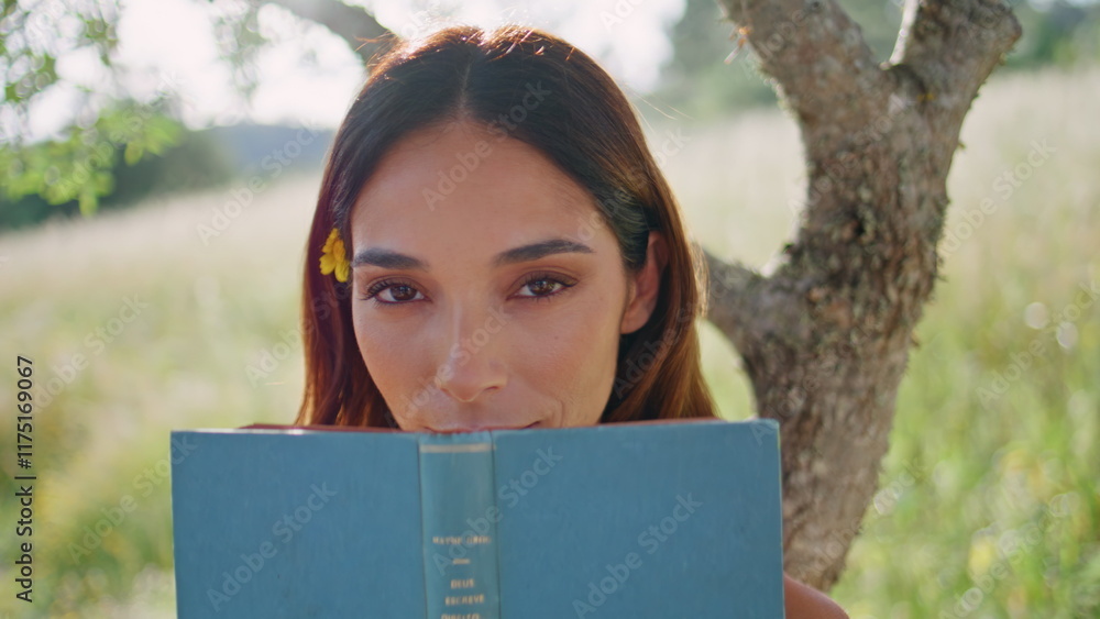 Rural girl posing book standing at tree nature closeup. Resting lady hiding face Rural girl posing book standing at tree nature closeup. Resting lady hiding face