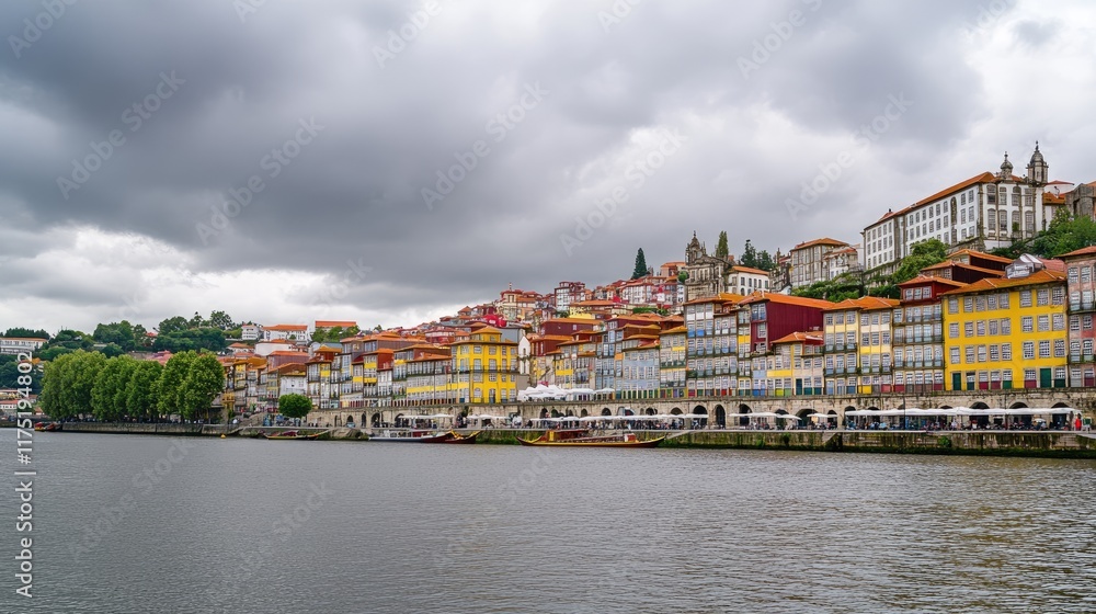 Obraz premium Colorful Portuguese Riverside Buildings Under Cloudy Sky