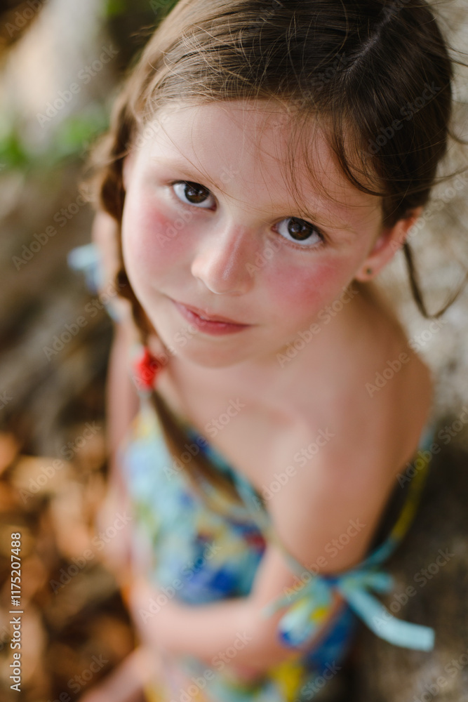 Portrait of a little girl with flowers in a tropical jungle in Thailand Portrait of a little girl with flowers in a tropical jungle in Thailand