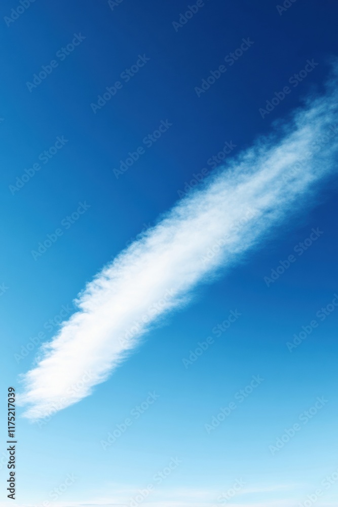A serene blue sky featuring a single wispy cloud drifting gracefully across the horizon, evoking calmness and peace. A serene blue sky featuring a single wispy cloud drifting gracefully across the horizon, evoking calmness and peace.