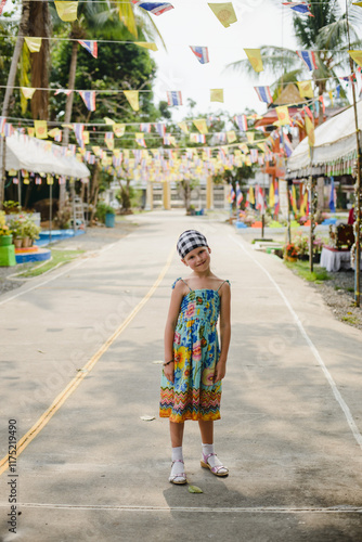 Portrait of a little girl in Asia in Thailand in the temple photo