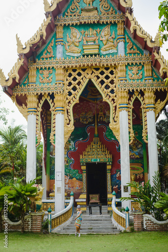 Portrait of a little girl in Asia in Thailand in the temple photo