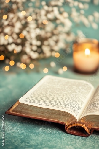 an open bible with candles
