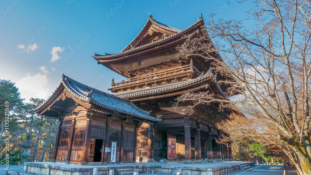 The majestic Sanmon Gate of Nanzenji Temple in Kyoto, Japan, bathed in winter sunlight. Traditional wooden architecture with intricate details, surrounded by bare trees. Kyoto, Japan. The majestic Sanmon Gate of Nanzenji Temple in Kyoto, Japan, bathed in winter sunlight. Traditional wooden architecture with intricate details, surrounded by bare trees. Kyoto, Japan.