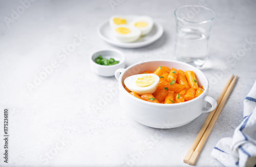 Hot and spicy tteokbokki in sauce in a bowl photo