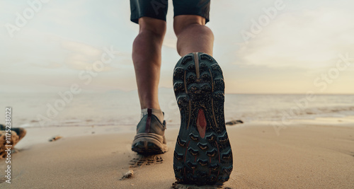 person walking on beach