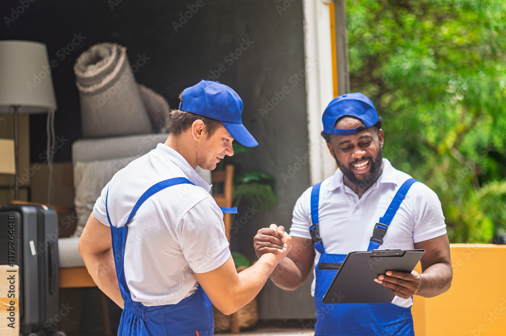 Happy service team of delivery worker working load customer boxes from truck and makes inventory of packed boxes and writes data to clipboard with smile confident and professional service