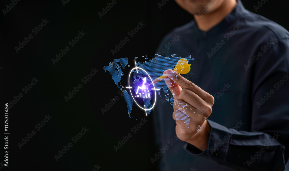 A businessman targeting a global market concept using a futuristic digital interface. The hand is holding a dart aimed at a virtual world map with a glowing target icon. innovation and strategic