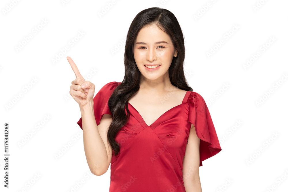 Smiling woman in red dress pointing upward with confidence Smiling woman in red dress pointing upward with confidence