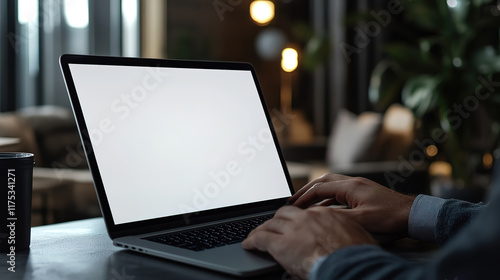 Close-up of male hands on laptop with blank screen