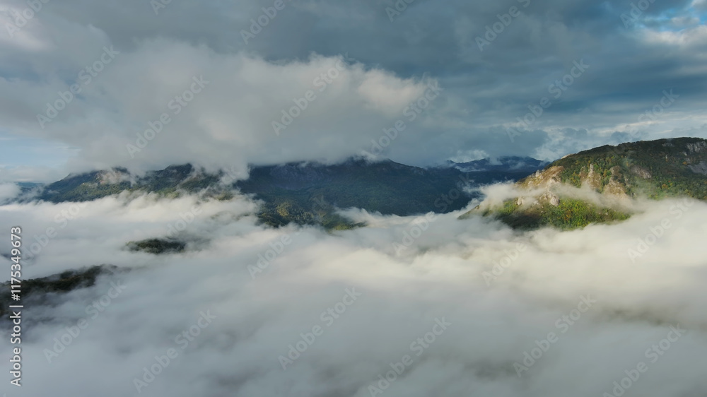 Aerial view of clouds and mountains at sunrise Aerial view of clouds and mountains at sunrise