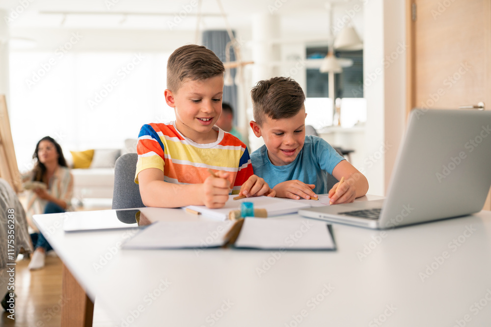 Caucasian brothers in casual attire collaborate on schoolwork using laptop and notebooks at bright home kitchen table while parent supervises. Caucasian brothers in casual attire collaborate on schoolwork using laptop and notebooks at bright home kitchen table while parent supervises.