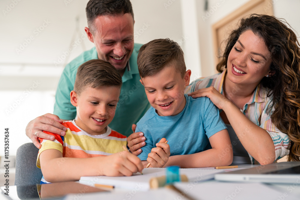 Caucasian parents provide educational support to two young boys working on school assignments at wooden dining table in bright domestic setting. Caucasian parents provide educational support to two young boys working on school assignments at wooden dining table in bright domestic setting.