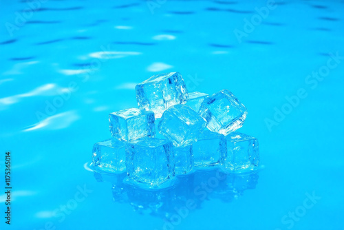 ice cubes submerged in turquoise water wavy surface bright lighting photo