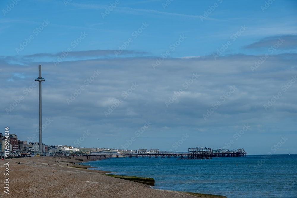 Fototapeta premium view of Brighton Palace Pier and British Airways i360 viewing tower in Brighton East Sussex England