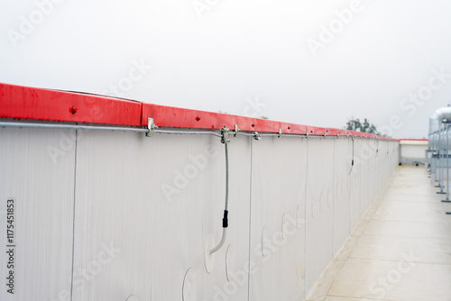 Photos Lightning protection wires along parapet wall close up selective focus