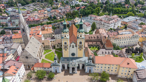 aerial drone view, Brixen, Bressanone city. View on the grand place with the cathedral and St. Michael church. sunny summer view. Photo for tourist brochure, publicity. City in south Tyrol. photo