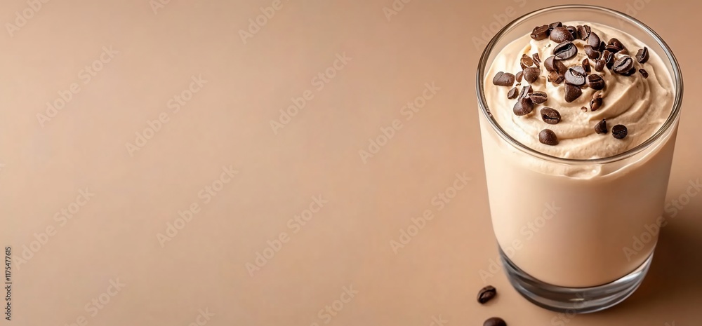 A creamy coffee dessert topped with coffee beans in a glass. A creamy coffee dessert topped with coffee beans in a glass.