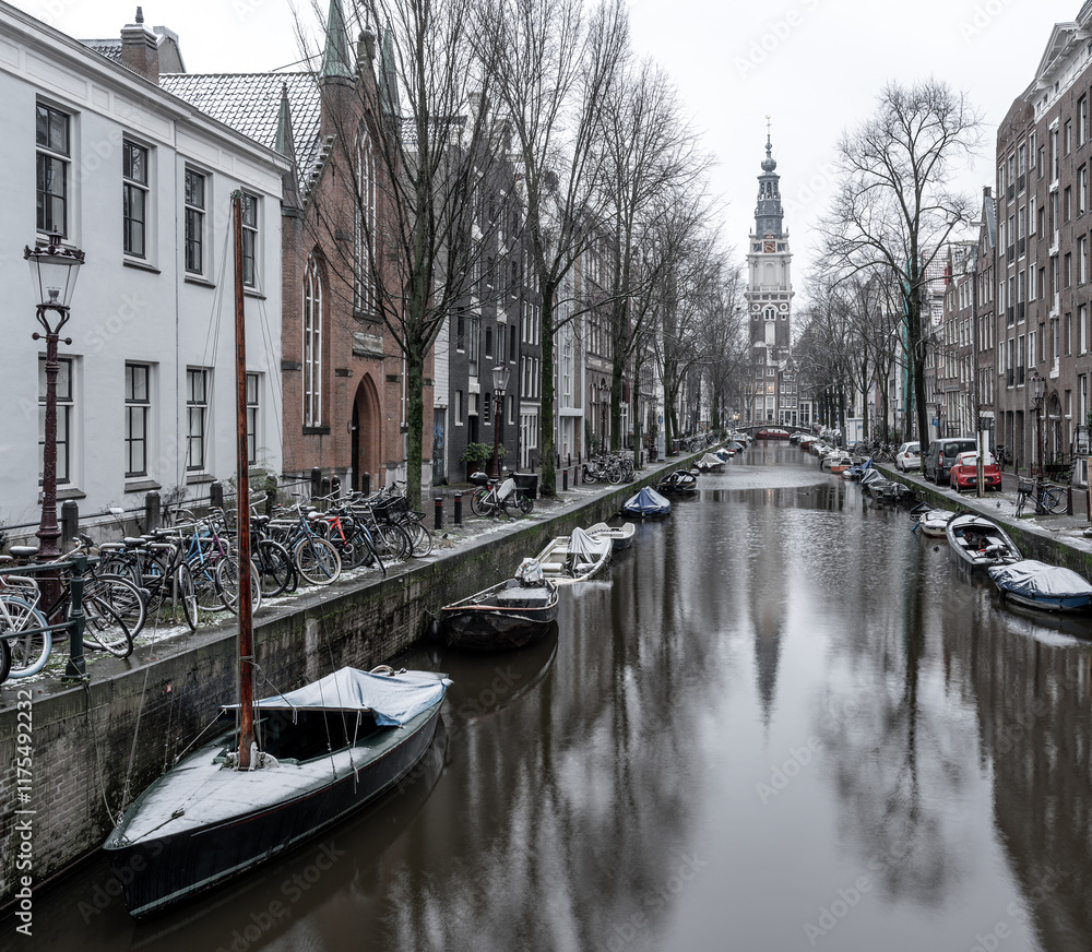 Fototapeta premium Amsterdam in Winter, Snowy Views of the Canal and the Zuiderkerk church
