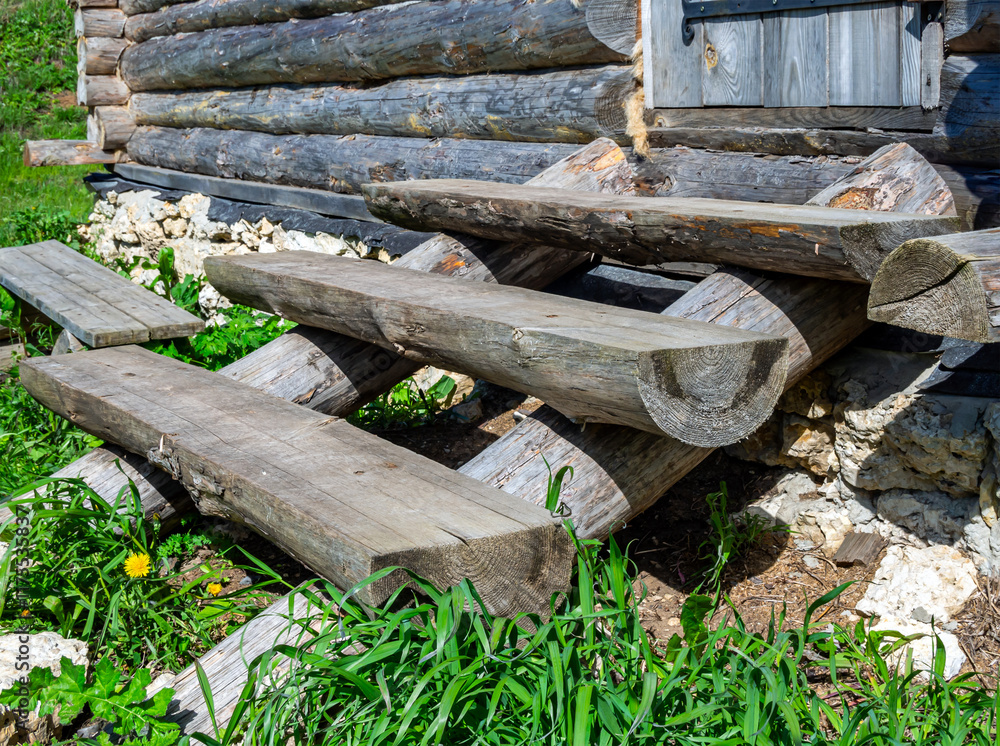 Wooden porch made from logs sawn in half lengthwise Wooden porch made from logs sawn in half lengthwise