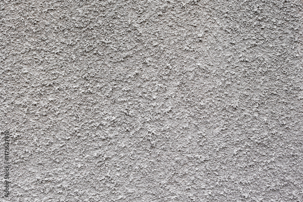 gray plaster wall texture with lots of details .