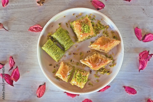 Different baklava slices on a white plate