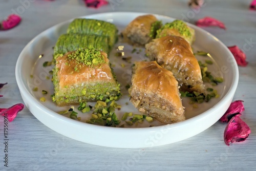 Different baklava slices on a white plate