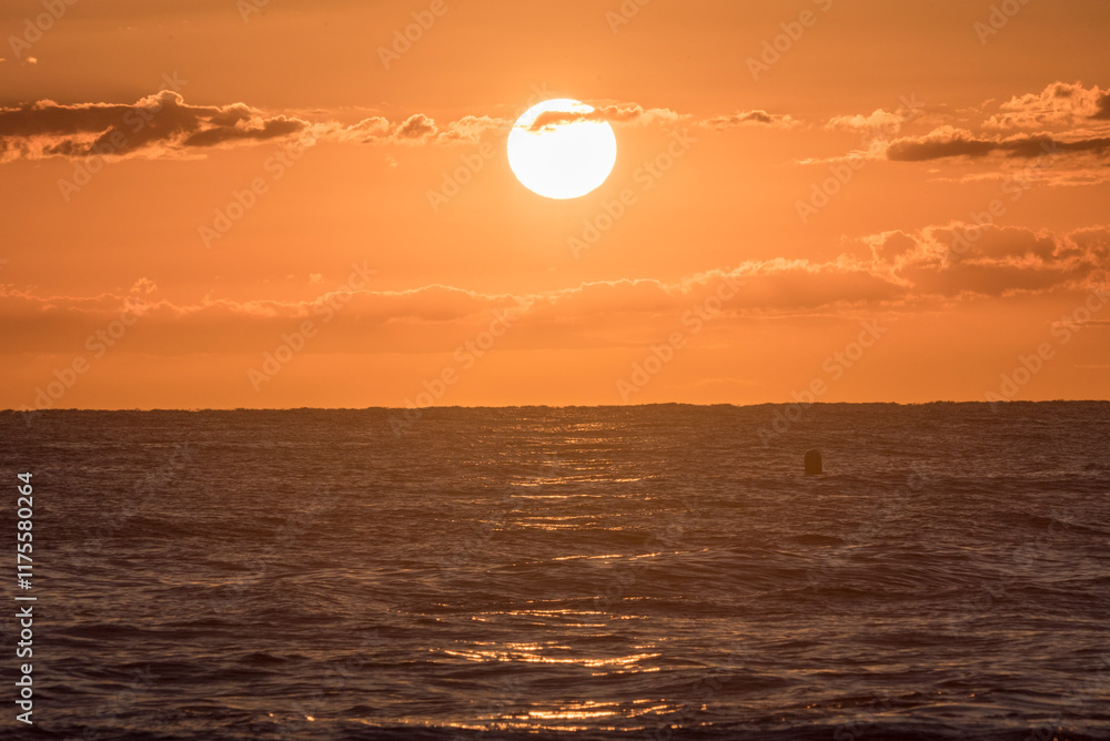 Sunrise on the beach. A nice sunrise. Lights and reflections of sunrise on a beautiful beach. Sunset colors. Sea waves Sunrise on the beach. A nice sunrise. Lights and reflections of sunrise on a beautiful beach. Sunset colors. Sea waves