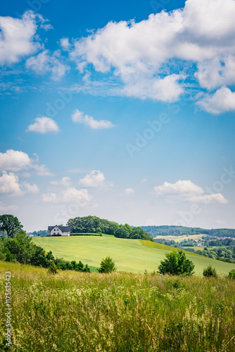 landscape with green field and sky, kashubia, poland