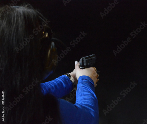Military girl with pistol