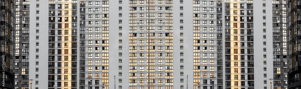 Urban window facade. Seamless pattern of a modern residential building with rows of identical windows on a concrete exterior. Contemporary architectural design for apartments, condos, or s in a city Urban window facade. Seamless pattern of a modern residential building with rows of identical windows on a concrete exterior. Contemporary architectural design for apartments, condos, or s in a city
