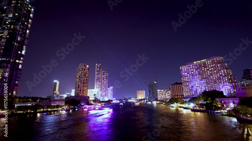 Wallpaper Mural Time-lapse of beautiful lights of water public transport, and boat traffic on the Chao Phraya River with condominium buildings. Hotels at night in Bangkok, Thailand's capital Torontodigital.ca