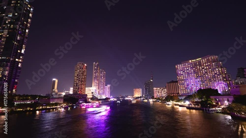 Wallpaper Mural Time-lapse of beautiful lights of water public transport, and boat traffic on the Chao Phraya River with condominium buildings. Hotels at night in Bangkok, Thailand's capital Torontodigital.ca