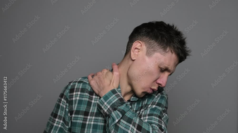 Back and neck pain, cervical spine hernia, man with backache at home, health problems concept. Man with neck and spine pain Back and neck pain, cervical spine hernia, man with backache at home, health problems concept. Man with neck and spine pain