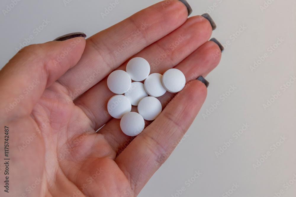 Woman hand holding pills or tablets. Concept of medicals, drug store, pharmacy, healthcare and medicine. Woman hand holding pills or tablets. Concept of medicals, drug store, pharmacy, healthcare and medicine.