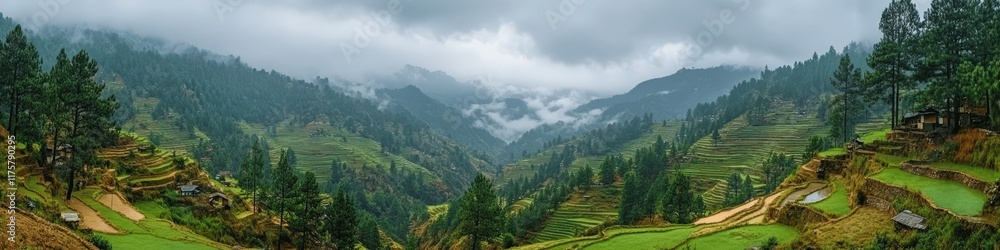 Obraz premium Breathtaking Scenic View of Majestic Mountain Valley with Lush Green Forests and Rolling Hills under Dramatic Cloudy Sky Perfect for Nature and Travel Enthusiasts